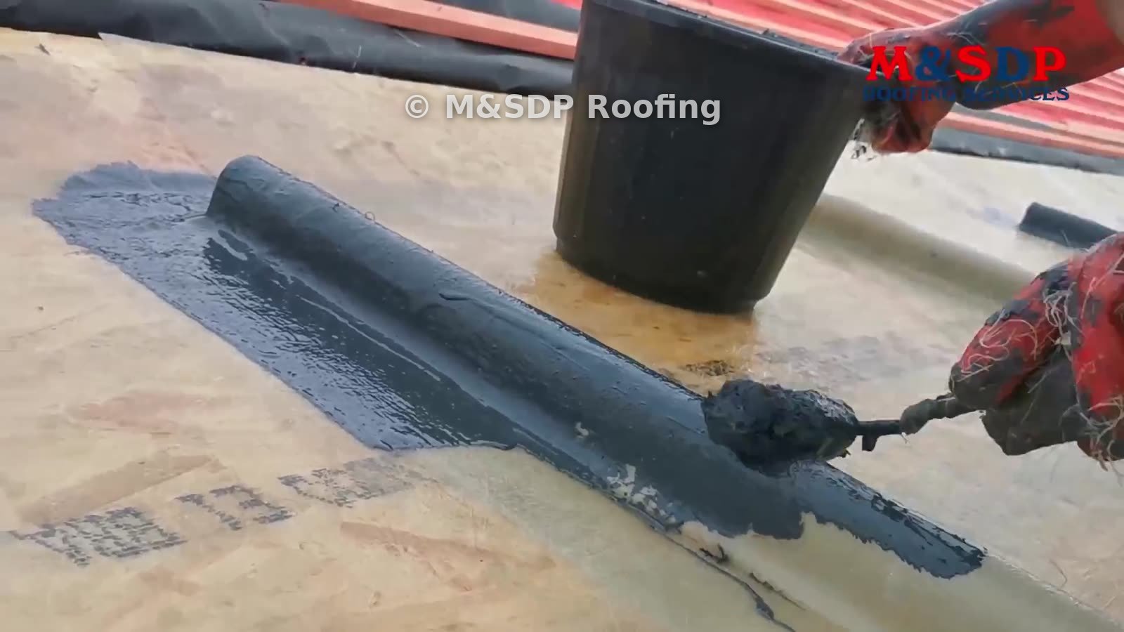 Topcoat being brushed onto a G.R.P. roof trim