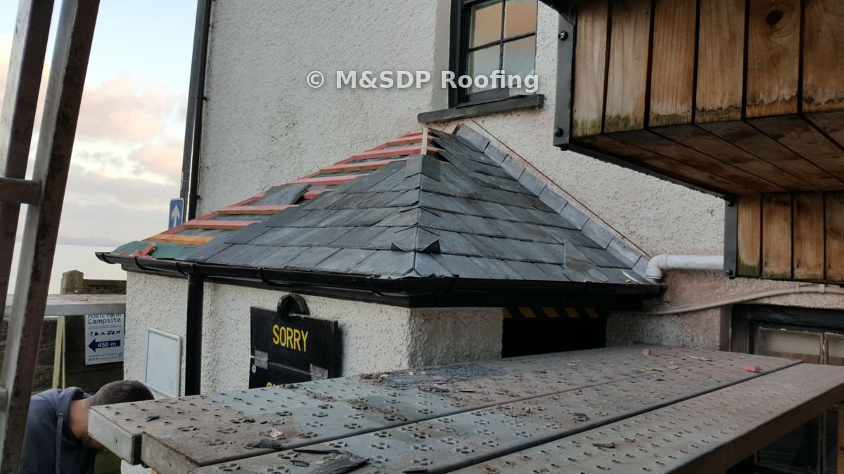 New battens and felt with slating under way