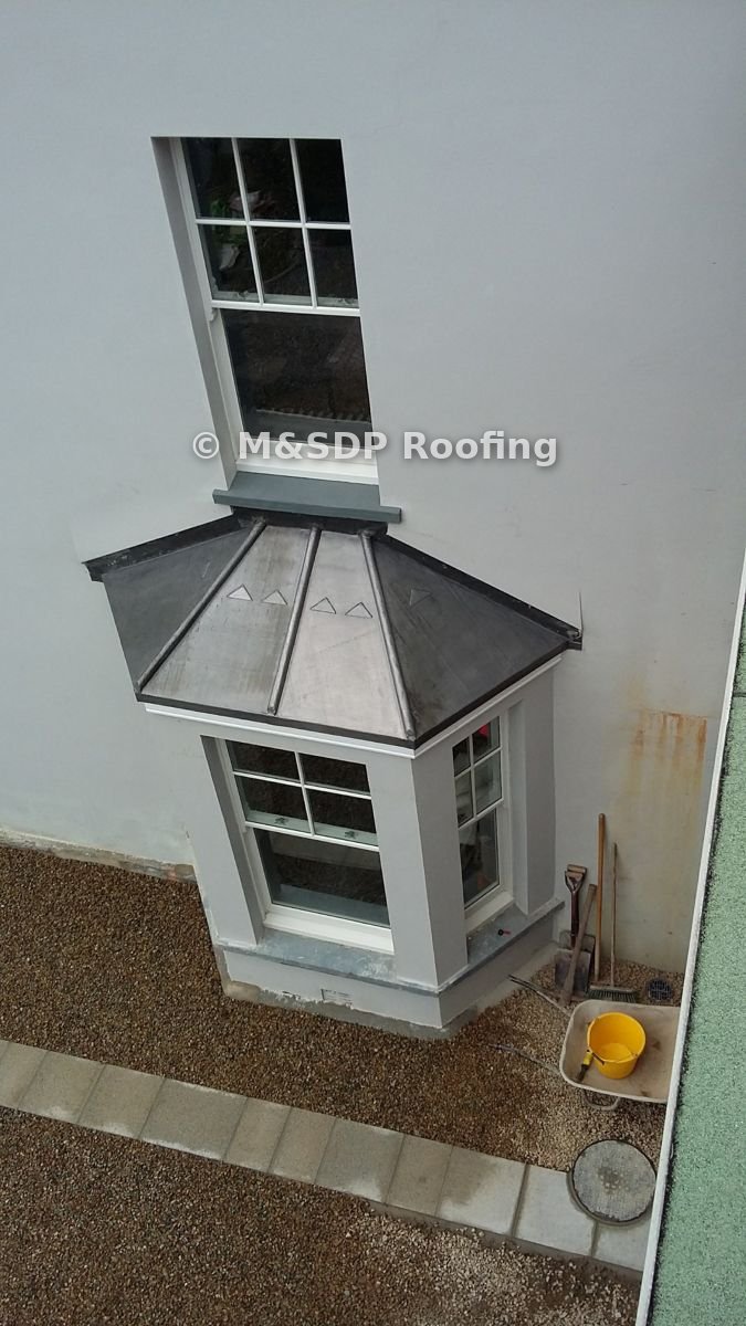 Lead bay window roof with rolls